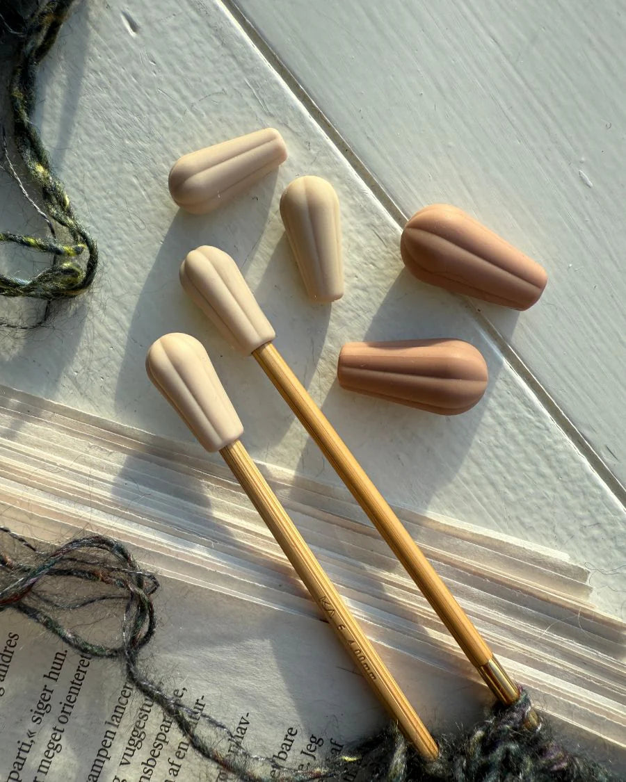 Petiteknit Pindebeskyttere